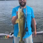 The author’s brother connected this 27-inch walleye with a slow-rolled swimbait worked off the breaks around large stands of weeds. Simonson Photo