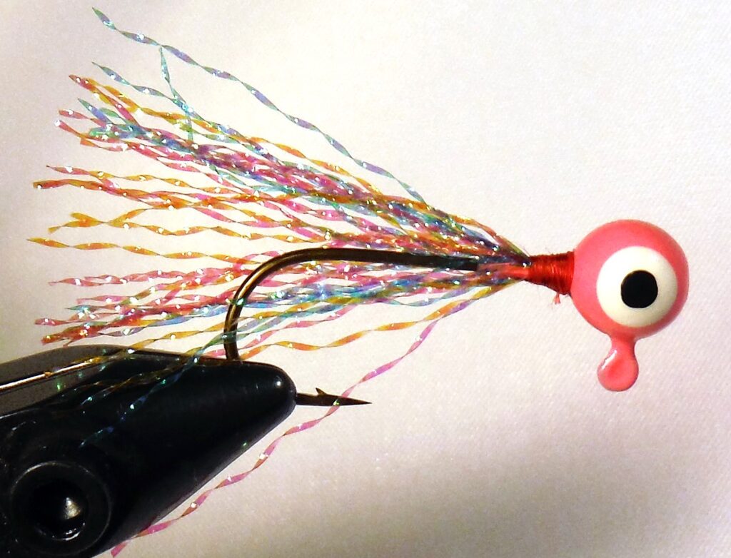 Thirty Strands. It doesn’t seem like much, but just a pinch of krystal flash secured to the hook shank creates a minnowlike appearance in the water with just the right amount of flow and movement. Simonson Photo.